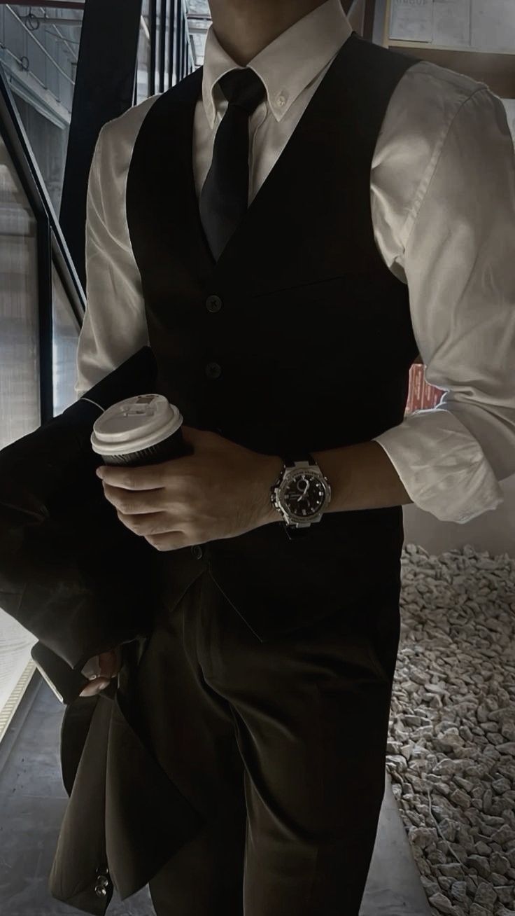 personal injury attorney wearing a suit holding coffee image